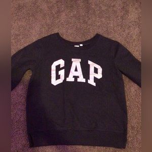 Crew neck with sliver sparkles that say GAP